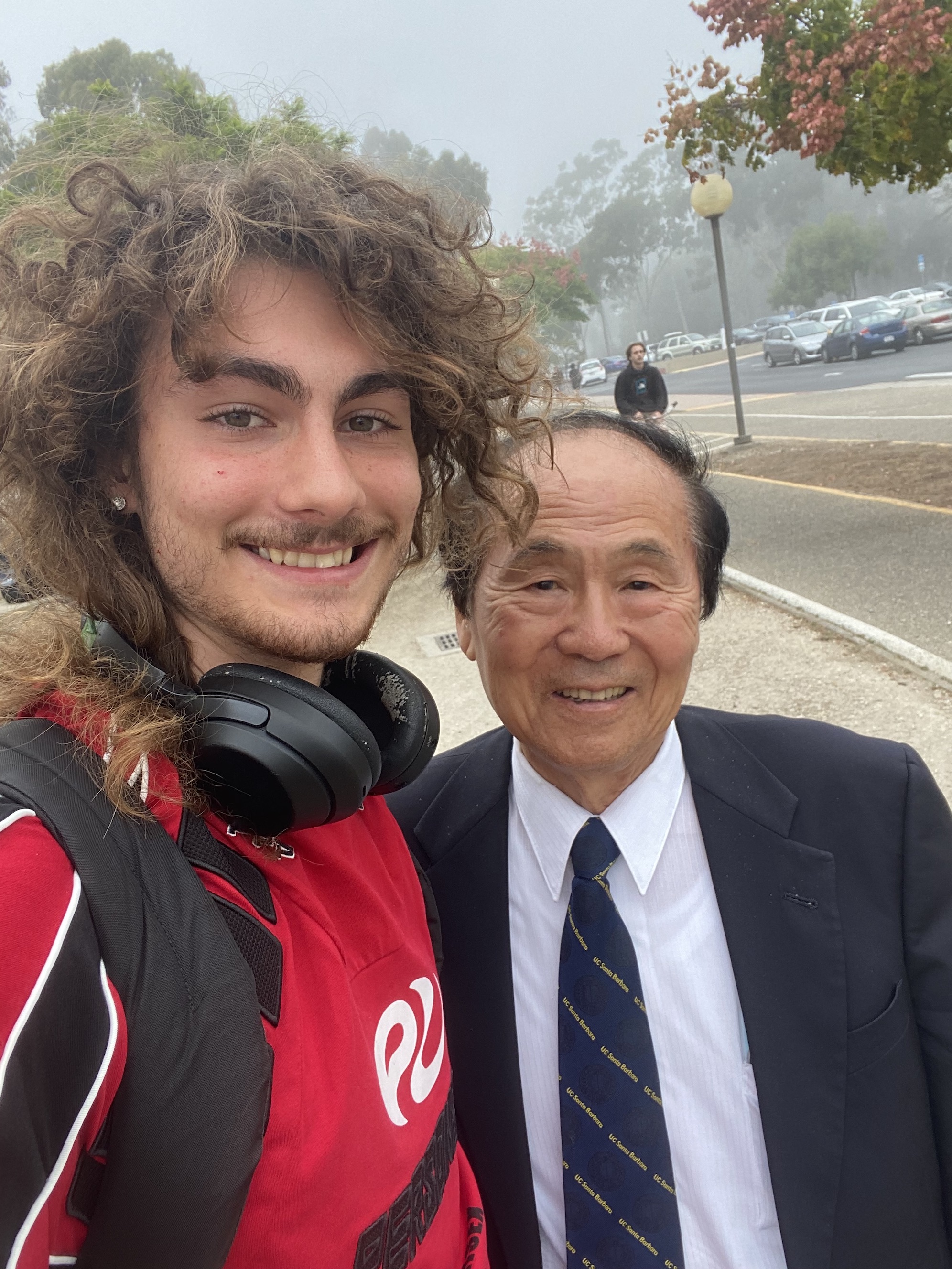 Picture of Zenon standing next to Chancellor Yang.