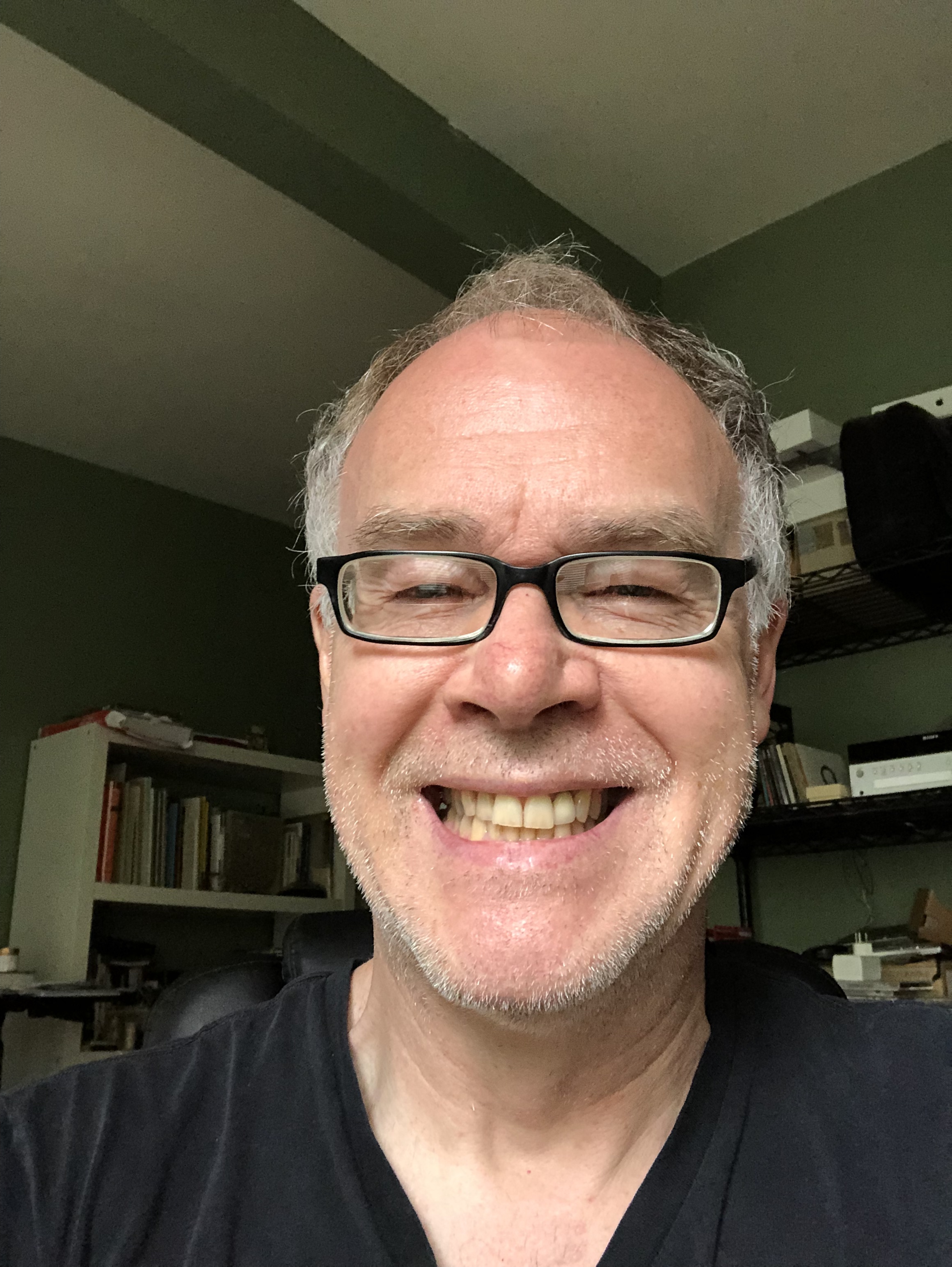 Headshot of Gene smiling