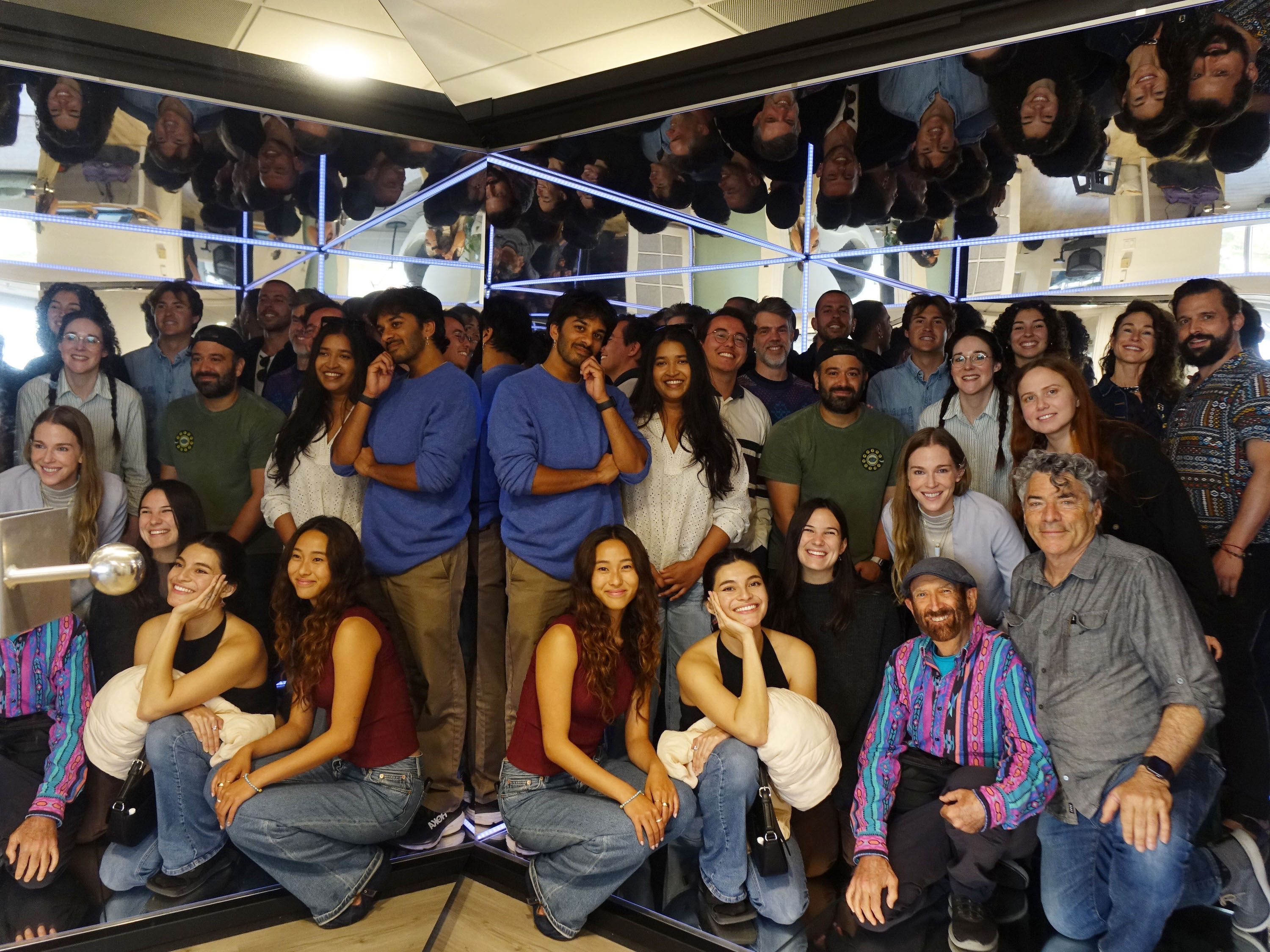 META Lab members inside a giant mirror box.